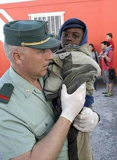 Spanish Civil Guard helps an immigrant kid